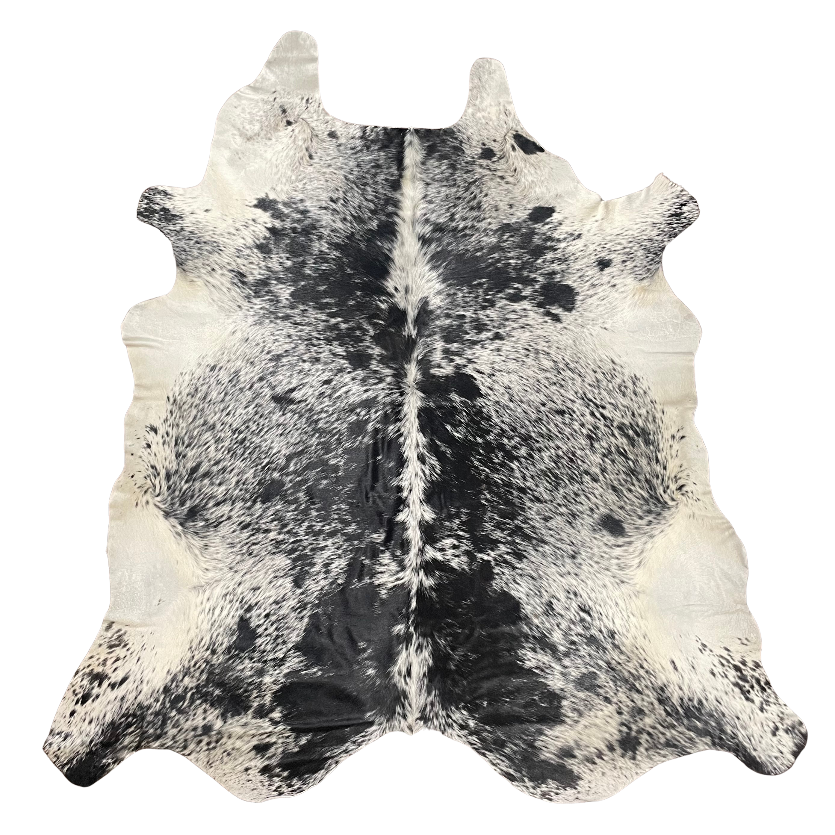 A natural black and white cowhide rug with a distinct spotted pattern and textured hide shape, shown flat against a solid white background.